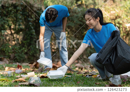 Young volunteers working together to clean up the park Young volunteers working together to clean up the park 126423273