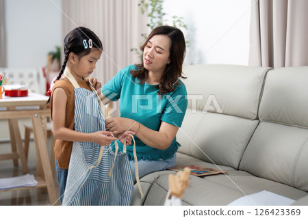 Activity mother and daughter preparing for creative painting session Activity mother and daughter preparing for creative painting session 126423369