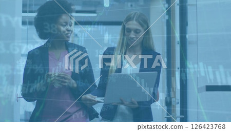 Image of financial data processing over diverse female colleagues using laptop in office 126423768