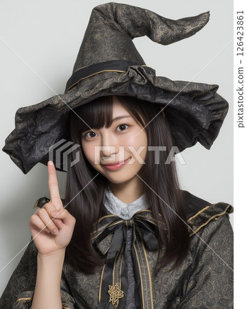 A woman dressed as a witch doing her best pose 126423861
