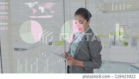 Image of data processing over caucasian businesswoman using tablet 126423922