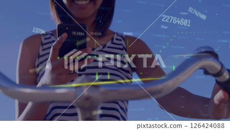 Image of graph and processing data over caucasian woman on bike using smartphone 126424088