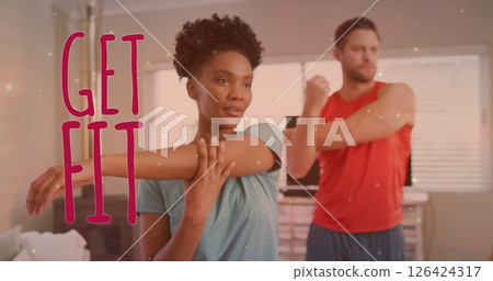 Image of get fit text over diverse couple stretching arms at home Image of get fit text over diverse couple stretching arms at home 126424317