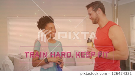 Image of train hard keep fit text over diverse couple drinking water at home Image of train hard keep fit text over diverse couple drinking water at home 126424321