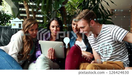 Image of financial data processing with icons over diverse colleagues using tablet in office 126424630