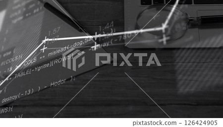 Mathematical equations and graphs image over desk with laptop and notebook 126424905