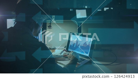 Analyzing financial data on laptop, person working late in office, image overlay 126424913