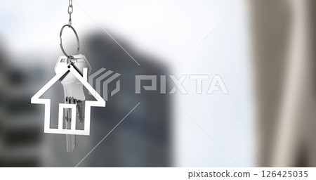House-shaped keychain image over blurred urban background House-shaped keychain image over blurred urban background 126425035