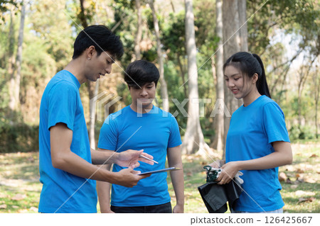 Sustainable volunteering. Youths collaborating for environmental cleanup. 126425667