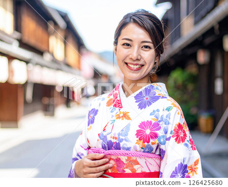 A woman in a kimono A woman in a kimono 126425680