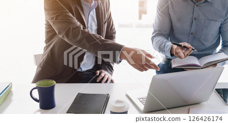 Asian business adviser meeting to analyze and discuss the situation on the financial report in the meeting room.Investment Consultant,Financial advisor and accounting concept 126426174