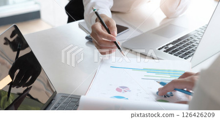 Close up Business people meeting to discuss the situation on the market. Business Financial Concept Close up Business people meeting to discuss the situation on the market. Business Financial Concept 126426209
