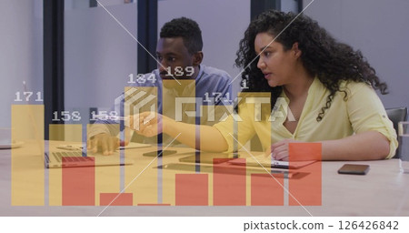 Image of financial data processing over diverse colleagues discussing work in office Image of financial data processing over diverse colleagues discussing work in office 126426842