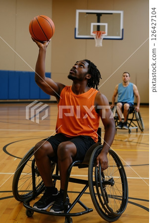 Wheelchair basketball player shooting hoop 126427104