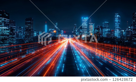 Vibrant cityscape at night showcasing light trails from moving vehicles. 126428672