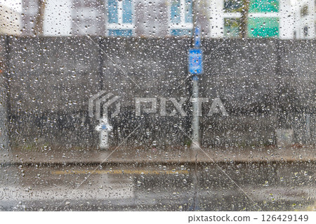 Water drops of rain on a window glass 126429149