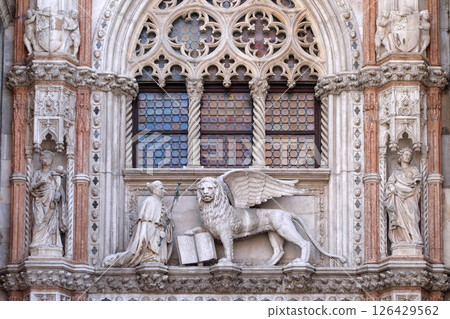 Detail of the Porta della Carta entrance to the Doge's Palace in Venice, Italy, depicting Doge Francesco Foscari kneeling before the Lion of St. Mark Detail of the Porta della Carta entrance to the Doge's Palace in Venice, Italy, depicting Doge Francesco Foscari kneeling before the Lion of St. Mark 126429562