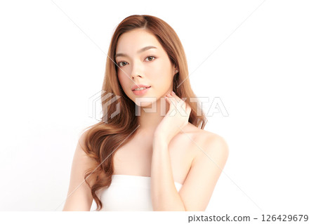 A beautiful young Asian woman with clean, fresh skin against a white background. Skincare, facial treatment, cosmetology, beauty, and spa. An elegant portrait of an Asian woman. A beautiful young Asian woman with clean, fresh skin against a white background. Skincare, facial treatment, cosmetology, beauty, and spa. An elegant portrait of an Asian woman. 126429679