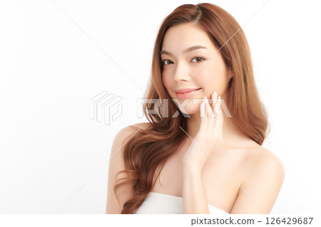 A beautiful young Asian woman with clean, fresh skin against a white background. Skincare, facial treatment, cosmetology, beauty, and spa. An elegant portrait of an Asian woman. A beautiful young Asian woman with clean, fresh skin against a white background. Skincare, facial treatment, cosmetology, beauty, and spa. An elegant portrait of an Asian woman. 126429687