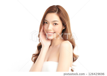 A beautiful young Asian woman with clean, fresh skin against a white background. Skincare, facial treatment, cosmetology, beauty, and spa. An elegant portrait of an Asian woman. 126429696