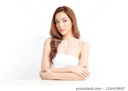 A beautiful young Asian woman with clean, fresh skin against a white background. Skincare, facial treatment, cosmetology, beauty, and spa. An elegant portrait of an Asian woman. A beautiful young Asian woman with clean, fresh skin against a white background. Skincare, facial treatment, cosmetology, beauty, and spa. An elegant portrait of an Asian woman. 126429697