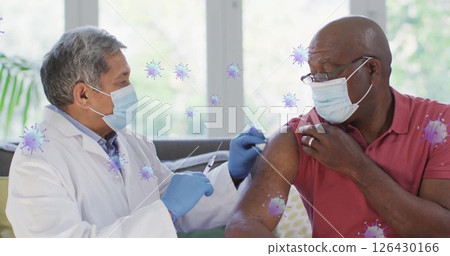 Image of virus cells over biracial male doctor with patient taking vaccine 126430166