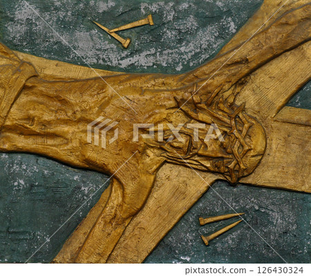 11th Station of the Cross - Crucifixion: Jesus is nailed to the cross 11th Station of the Cross - Crucifixion: Jesus is nailed to the cross 126430324