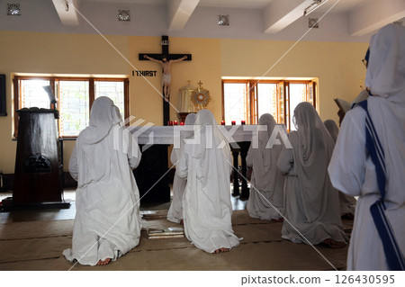 Sisters of Mother Teresa's Missionaries of Charity in prayer in the chapel of the Mother House, Kolkata, India Sisters of Mother Teresa's Missionaries of Charity in prayer in the chapel of the Mother House, Kolkata, India 126430595
