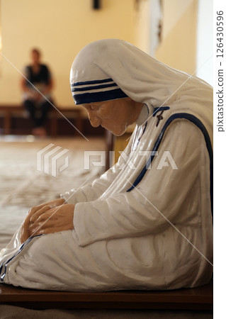 Statue of Mother Teresa in the chapel of the Mother House, Kolkata, India. The statue was made in the pose in which the Mother prayed. Statue of Mother Teresa in the chapel of the Mother House, Kolkata, India. The statue was made in the pose in which the Mother prayed. 126430596