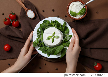 Ricotta in a bowl with fresh tomatoes and herbs 126430645