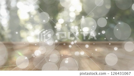 Image of white spots and wooden table over forest 126431067