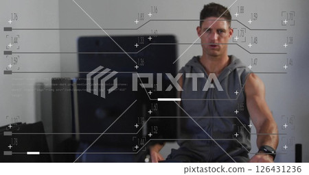 Image of data processing over caucasian man using indoor rower at gym 126431236