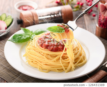 A dish of steaming tomato sauce pasta and sizzling basil (meat sauce pasta) 126431389