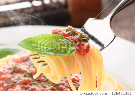 A dish of steaming tomato sauce pasta and sizzling basil (meat sauce pasta) 126431391