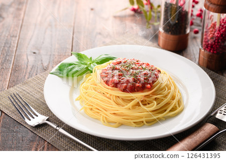 A dish of steaming tomato sauce pasta and sizzling basil (meat sauce pasta) 126431395