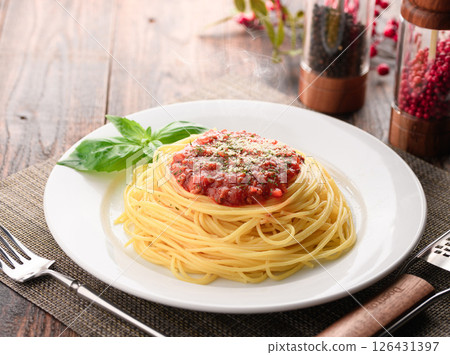 A dish of steaming tomato sauce pasta and sizzling basil (meat sauce pasta) 126431397