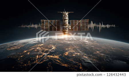 Satellite monitoring environmental changes or climate action orbits Earth at night, showing illuminated city lights and glowing horizon 126432443