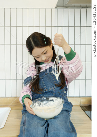 Children checking the bubbles they worked hard to create 126433158