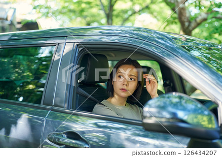 A woman driving a car A woman driving a car 126434207