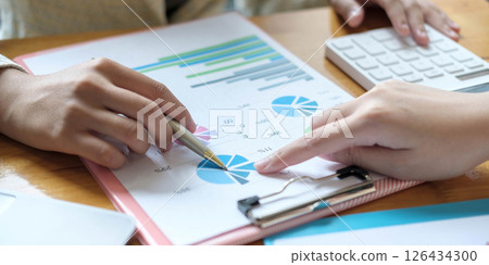 Close up Business people meeting to discuss the situation on the market. Business Financial Concept Close up Business people meeting to discuss the situation on the market. Business Financial Concept 126434300