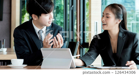 Fund managers team consultation and discuss about analysis Investment stock market by digital tablet. 126434306