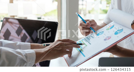 Close up Business people meeting to discuss the situation on the market. Business Financial Concept Close up Business people meeting to discuss the situation on the market. Business Financial Concept 126434315