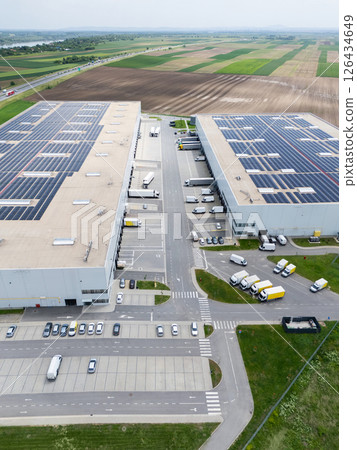 Logistics centers with solar panels on roofs. Aerial view Logistics centers with solar panels on roofs. Aerial view 126434649