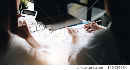 Asian Business team working for marketing together at meeting room office.conference and discussing the charts and graphs showing the results of their successful teamwork,business planning concept. 126434684