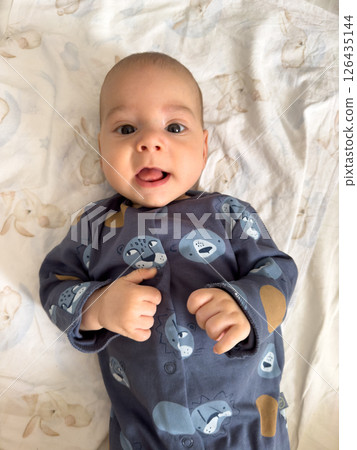 Baby in Blue Onesie with Animal Prints 126435144