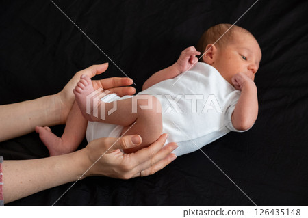 Newborn Baby on Black Background 126435148