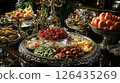 High-end hors d'oeuvres served on polished silver trays, surrounded by fine .. 126435269