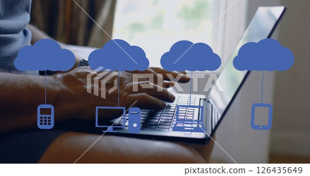 Image of media icons over caucasian man using laptop Image of media icons over caucasian man using laptop 126435649