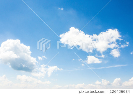 sky with fluffy clouds. azure peaceful softness.white cumulus cloudscape on a blue gradient of atmosphere. sunny summer weather. scenic nature background. meteorology backdrop. fresh air 126436684