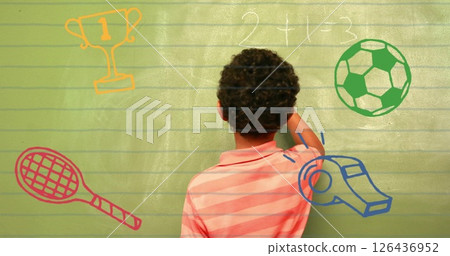 Image of school icons over afican american schoolboy writing on chalkboard Image of school icons over afican american schoolboy writing on chalkboard 126436952